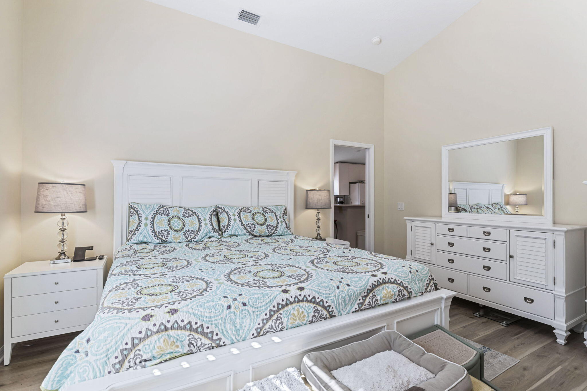 2140 Spring Creek Circle Palm Bay, FL 32905 - Photo 14 of 32 a bedroom with a large bed and a dresser