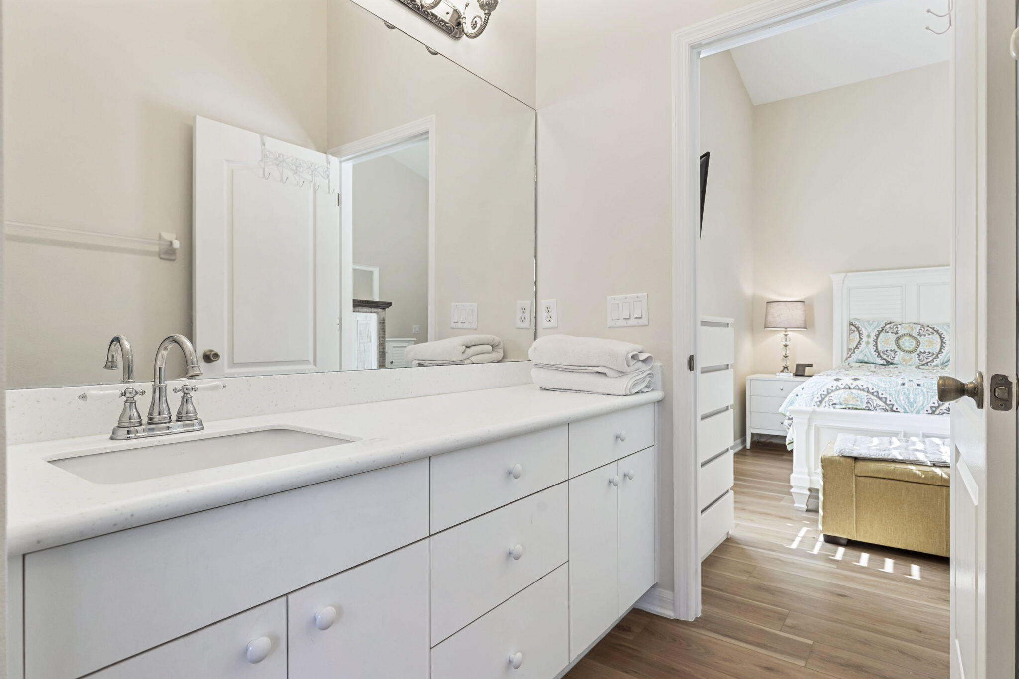 2140 Spring Creek Circle Palm Bay, FL 32905 - Photo 16 of 32 a en suite bathroom with double sink and a mirror