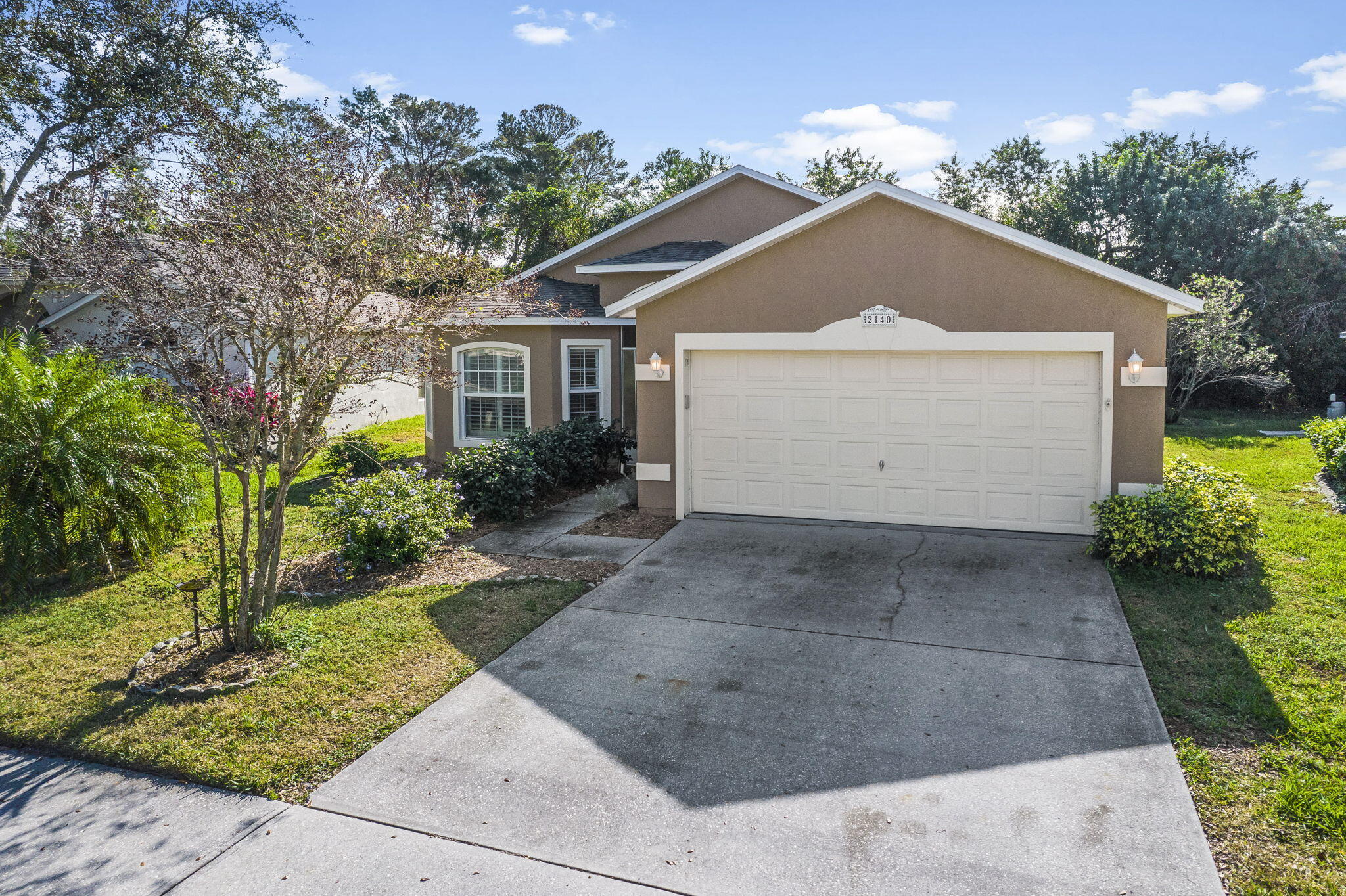 2140 Spring Creek Circle Palm Bay, FL 32905 - Photo 27 of 32 a front view of house with garden