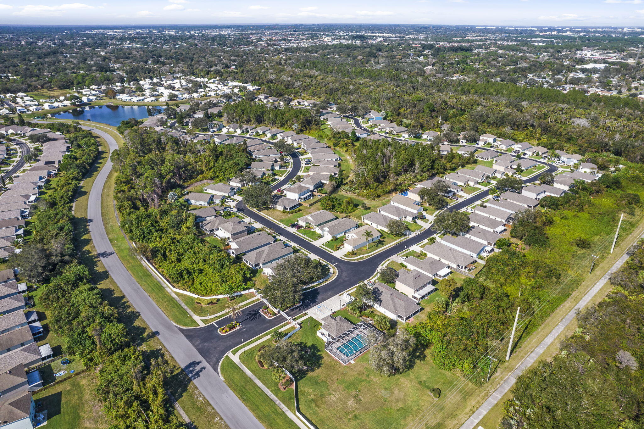 2140 Spring Creek Circle Palm Bay, FL 32905 - Photo 29 of 32 an aerial view of residential houses with outdoor space