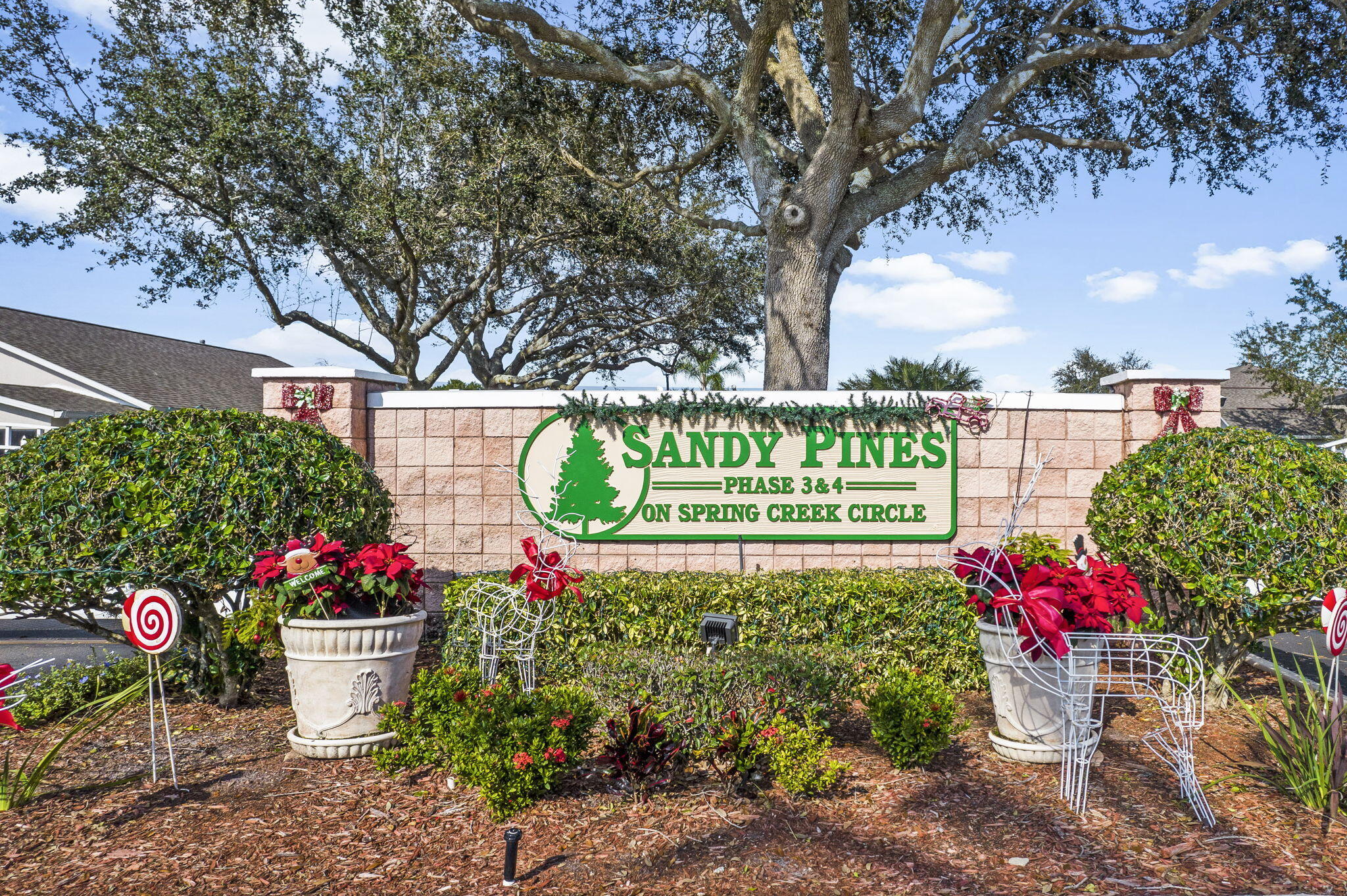 2140 Spring Creek Circle Palm Bay, FL 32905 - Photo 31 of 32 a sign that is in front of flowers