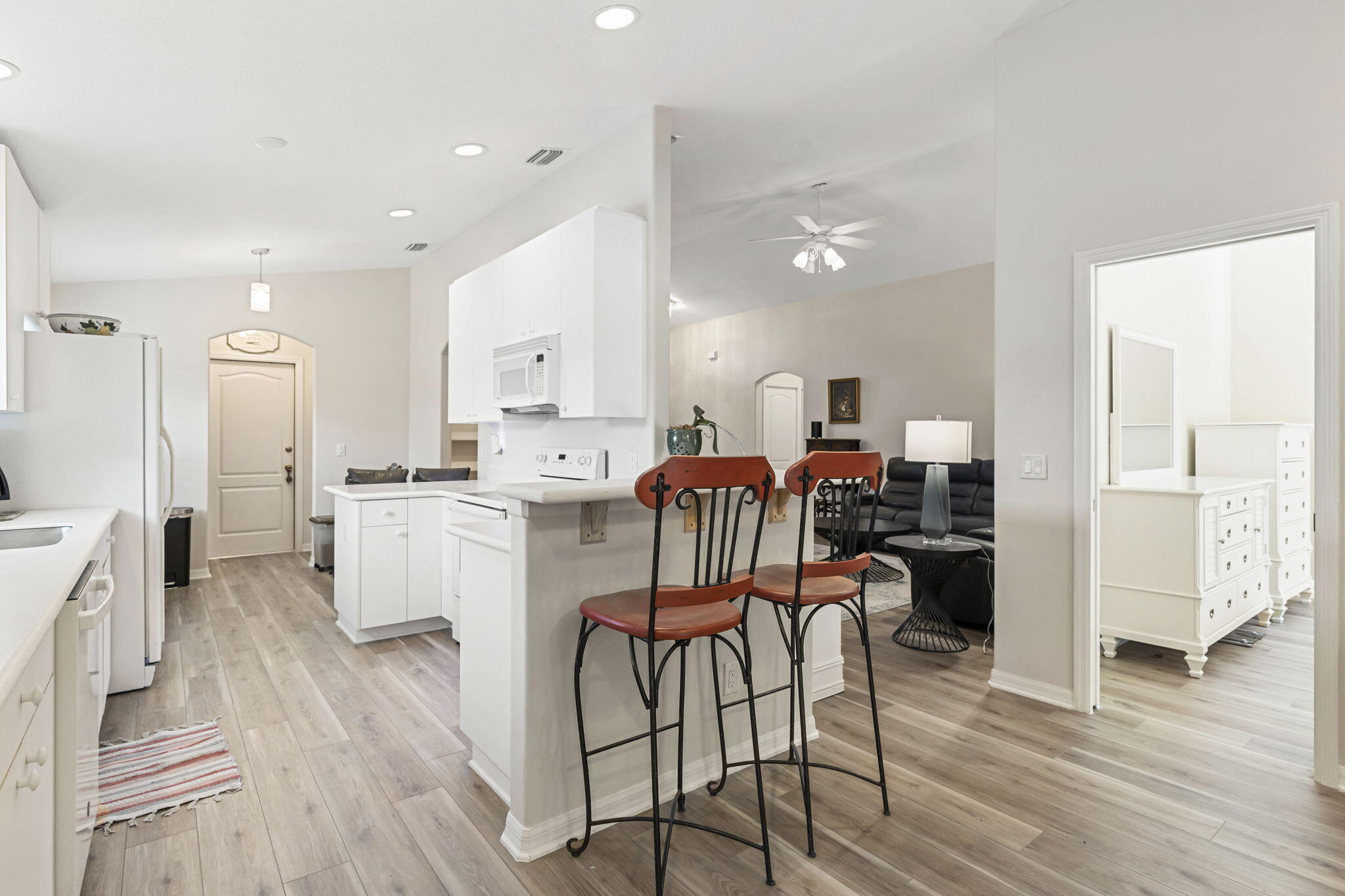 2140 Spring Creek Circle Palm Bay, FL 32905 - Photo 4 of 32 a living room with furniture and kitchen view