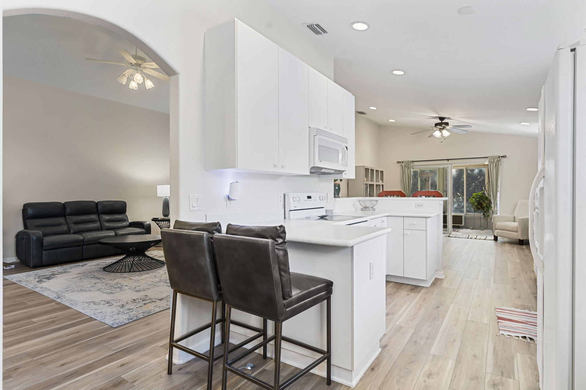 2140 Spring Creek Circle Palm Bay, FL 32905 - Photo 8 of 32 a open kitchen with stainless steel appliances kitchen island granite countertop a sink and cabinets