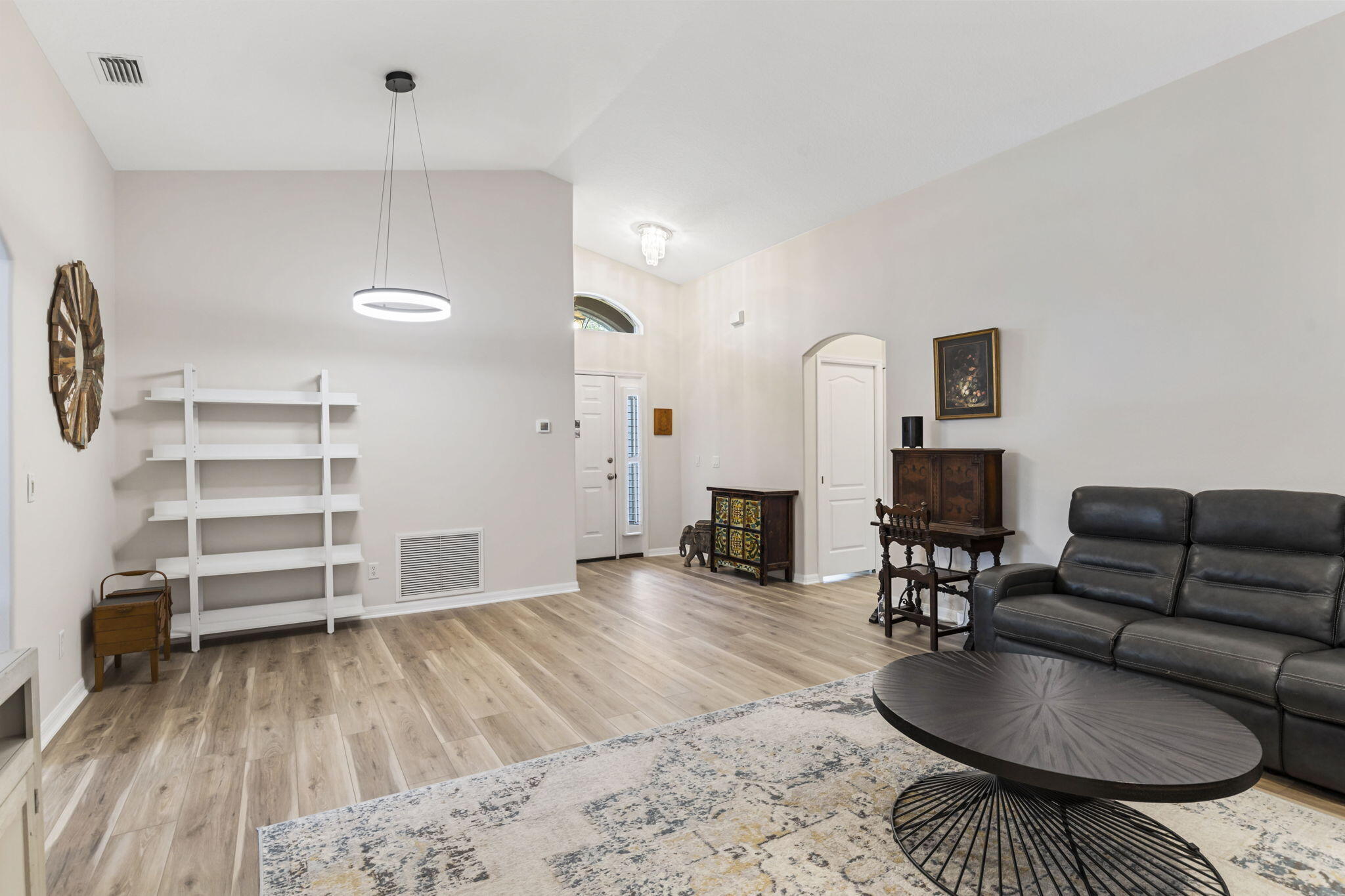 2140 Spring Creek Circle Palm Bay, FL 32905 - Photo 10 of 32 a living room with furniture and a wooden floor
