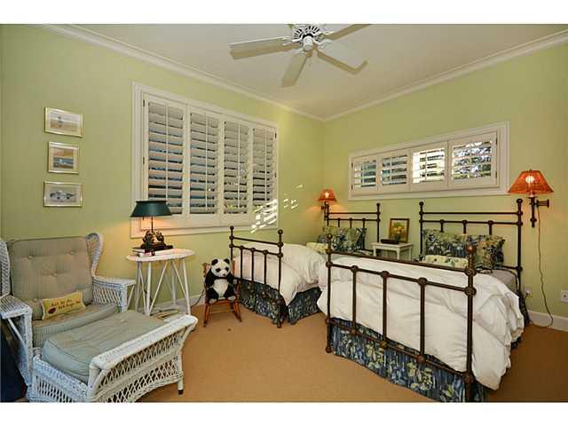 23 West High Point Road Sewall's Point, FL 34996 - Photo 19 of 25 a bedroom with furniture and a window