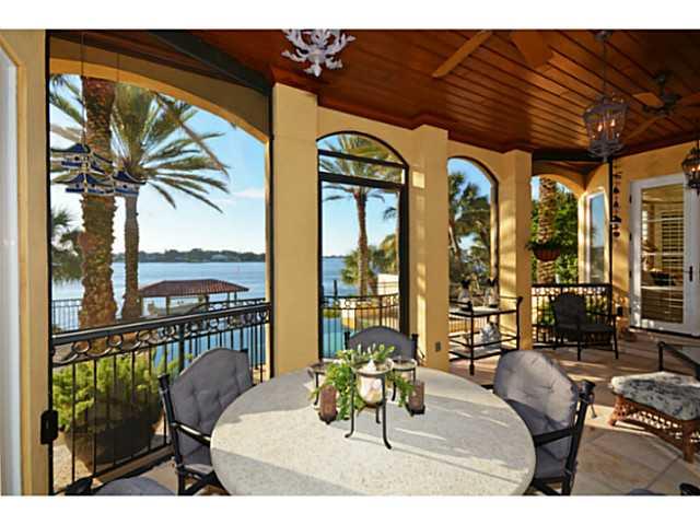 23 West High Point Road Sewall's Point, FL 34996 - Photo 21 of 25 a balcony with furniture and large windows