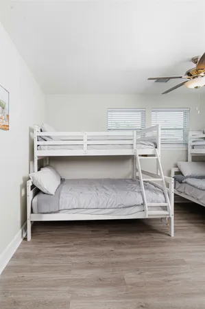 a view of bedroom with furniture and wooden floor