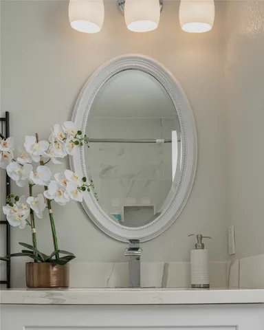a kitchen with stainless steel appliances granite countertop a refrigerator stove and sink