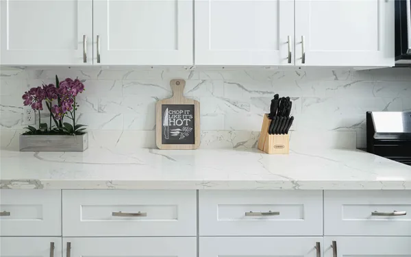 a kitchen with a sink and cabinets