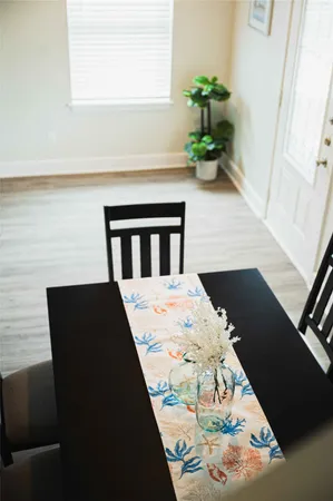 a view of balcony with wooden floor