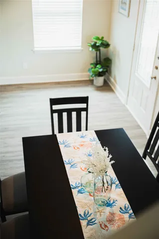 a view of balcony with wooden floor