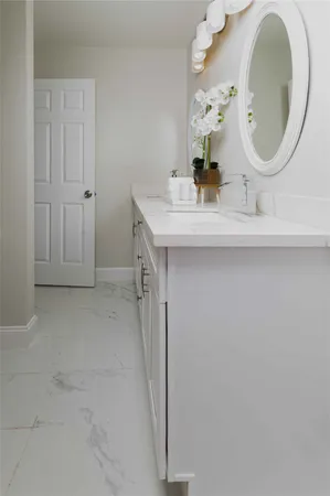 a bathroom with a sink and a mirror