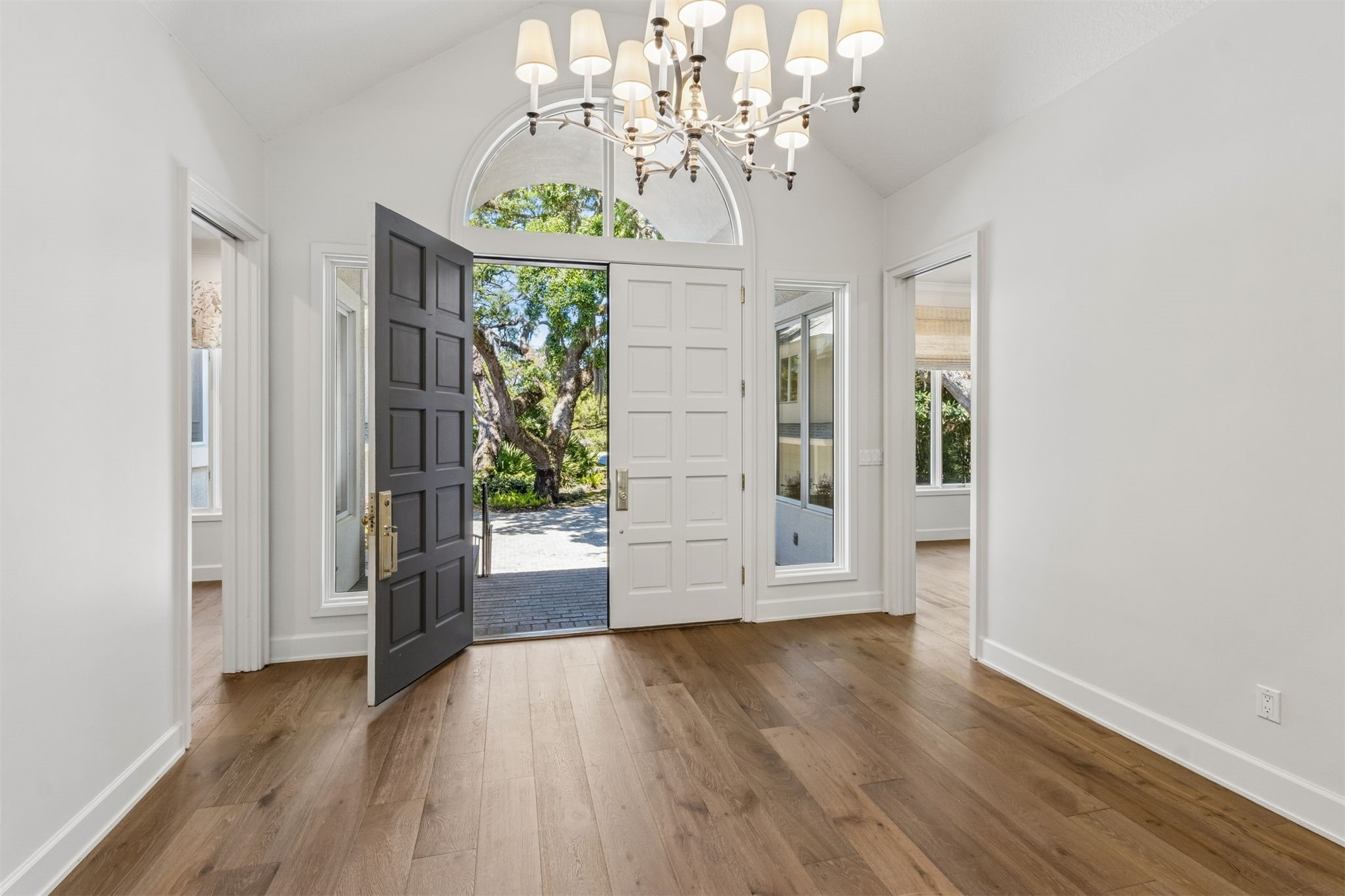 4 Salt Marsh Drive Fernandina Beach, FL 32034 - Photo 14 of 60 a view of a room with wooden floor chandelier and windows