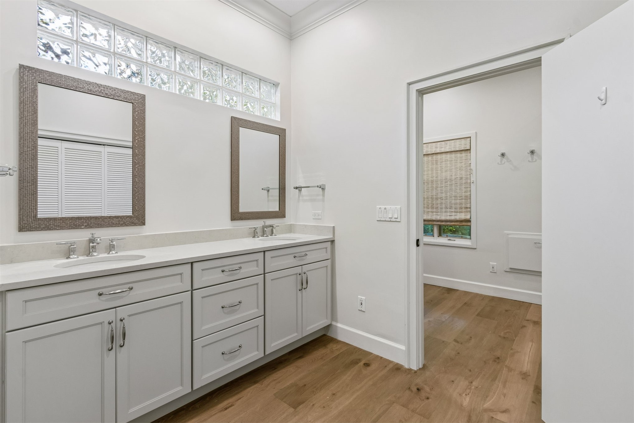 4 Salt Marsh Drive Fernandina Beach, FL 32034 - Photo 20 of 60 a spacious bathroom with a double vanity sink and mirror