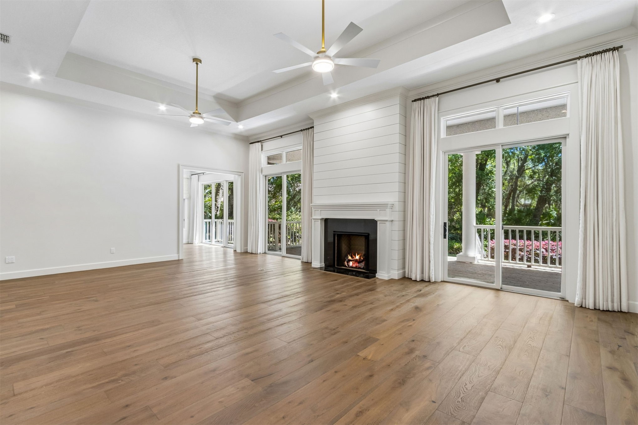 4 Salt Marsh Drive Fernandina Beach, FL 32034 - Photo 32 of 60 a view of an empty room with wooden floor fireplace and a window