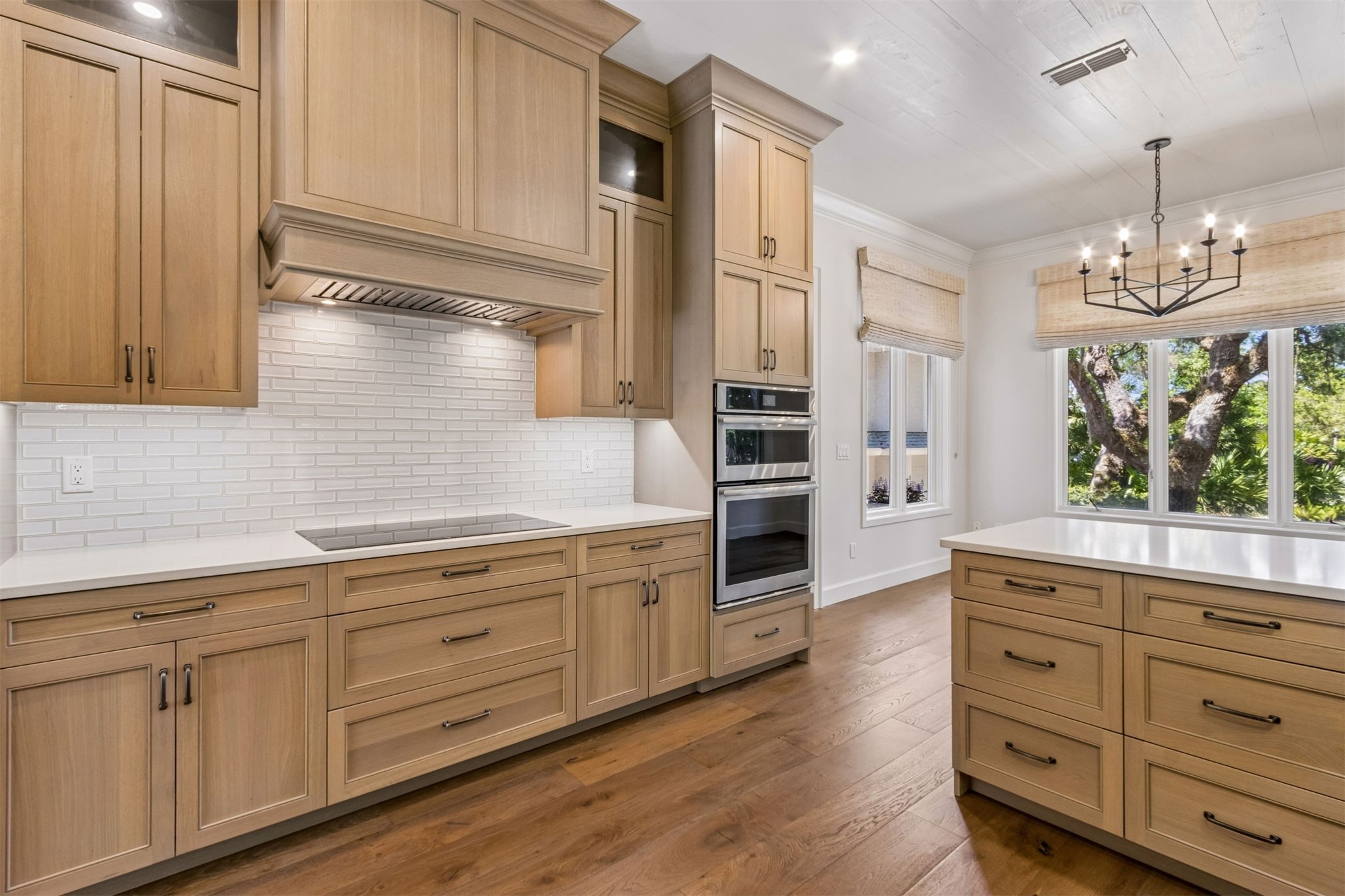 4 Salt Marsh Drive Fernandina Beach, FL 32034 - Photo 10 of 60 a kitchen with cabinets wooden floor and stainless steel appliances