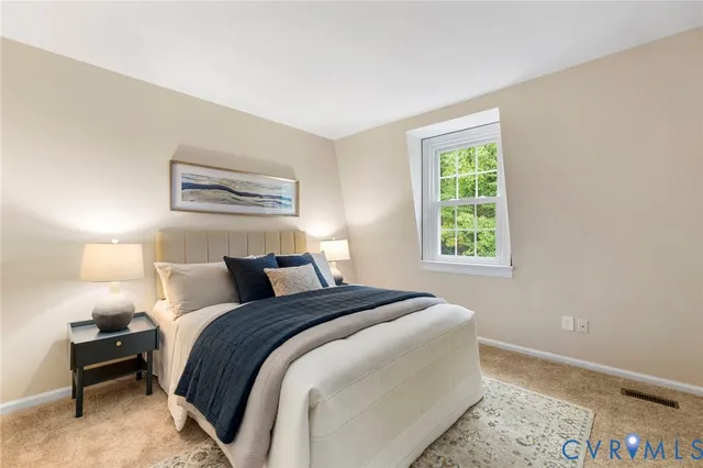 a bedroom with bed and a window