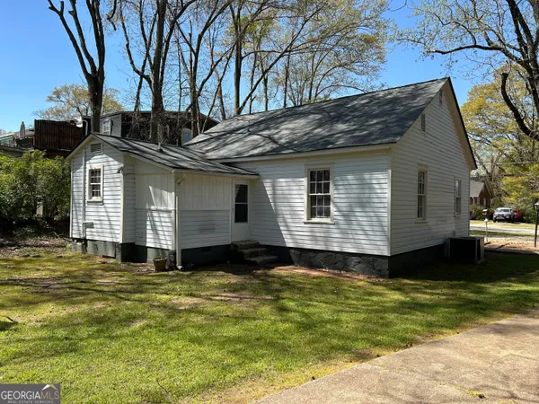 a house with trees in the background