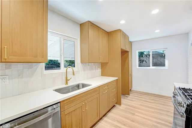 a kitchen with a sink and cabinets