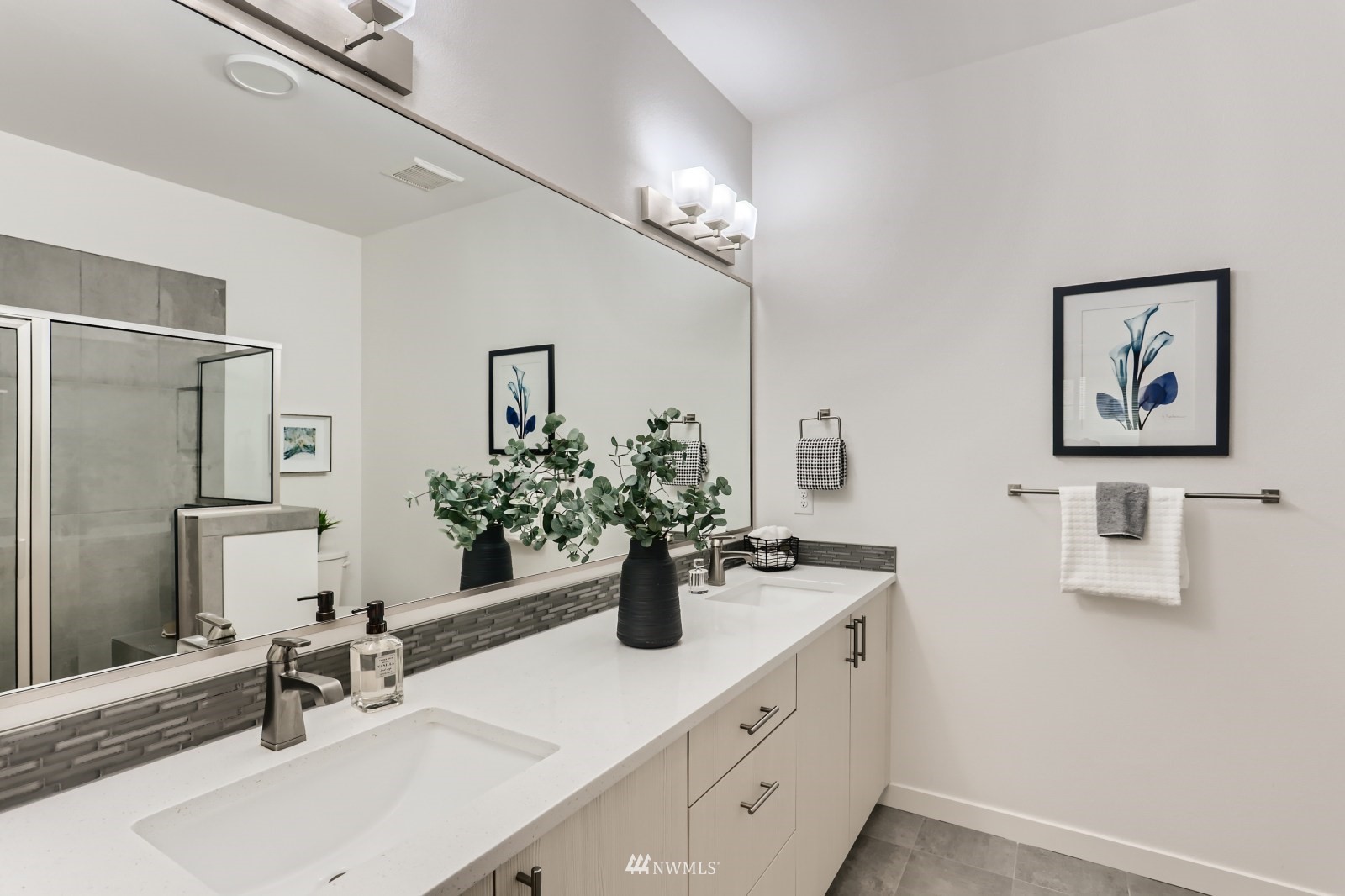 15873 Northeast 14th Road, Unit 7 7 Bellevue, WA 98008 - Photo 11 of 16 a bathroom with a sink double vanity and a mirror