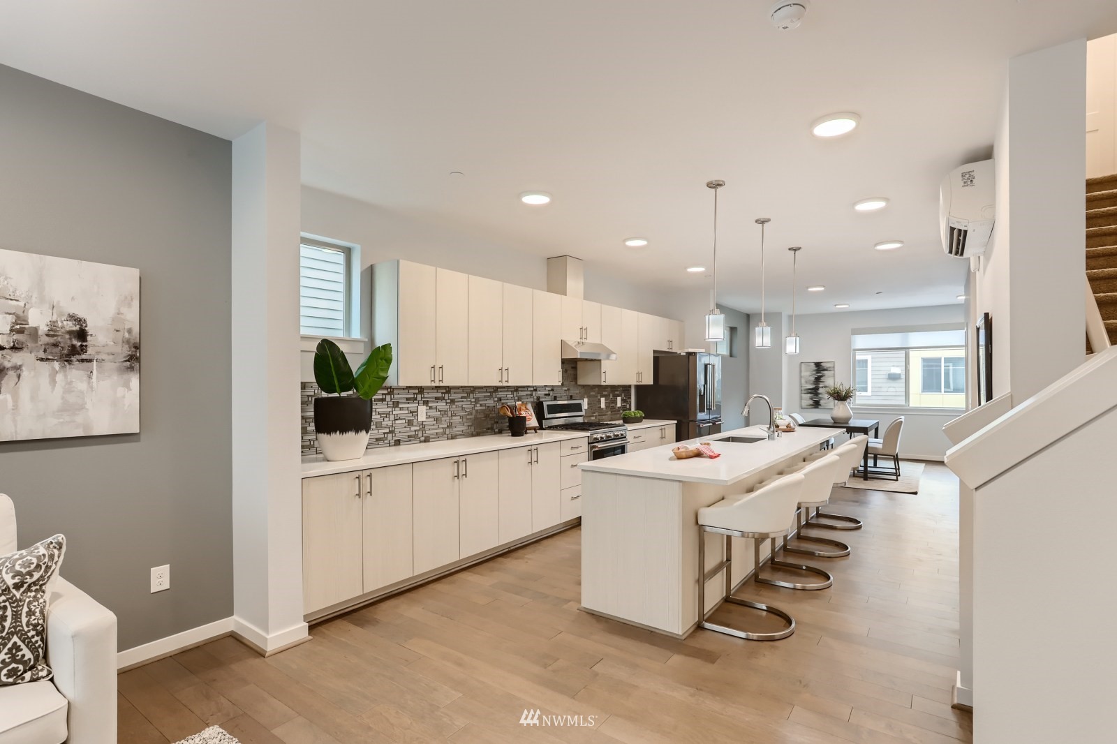 15873 Northeast 14th Road, Unit 7 7 Bellevue, WA 98008 - Photo 5 of 16 a kitchen that has a lot of cabinets a sink and a counter top space