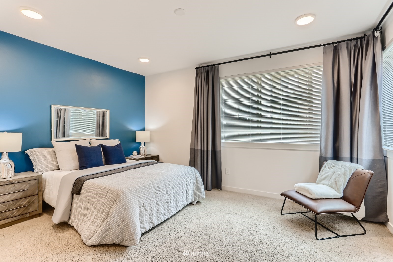 15873 Northeast 14th Road, Unit 7 7 Bellevue, WA 98008 - Photo 9 of 16 a bedroom with two beds and a chair