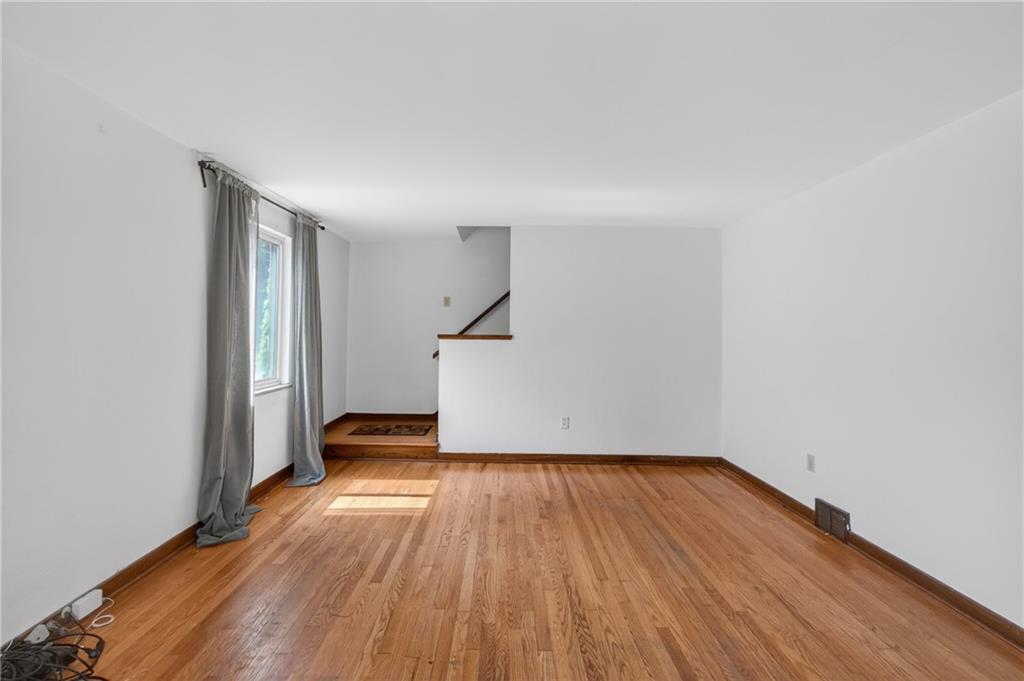 1420 Homestead Road Verona, PA 15147 - Photo 7 of 34 a view of empty room with wooden floor