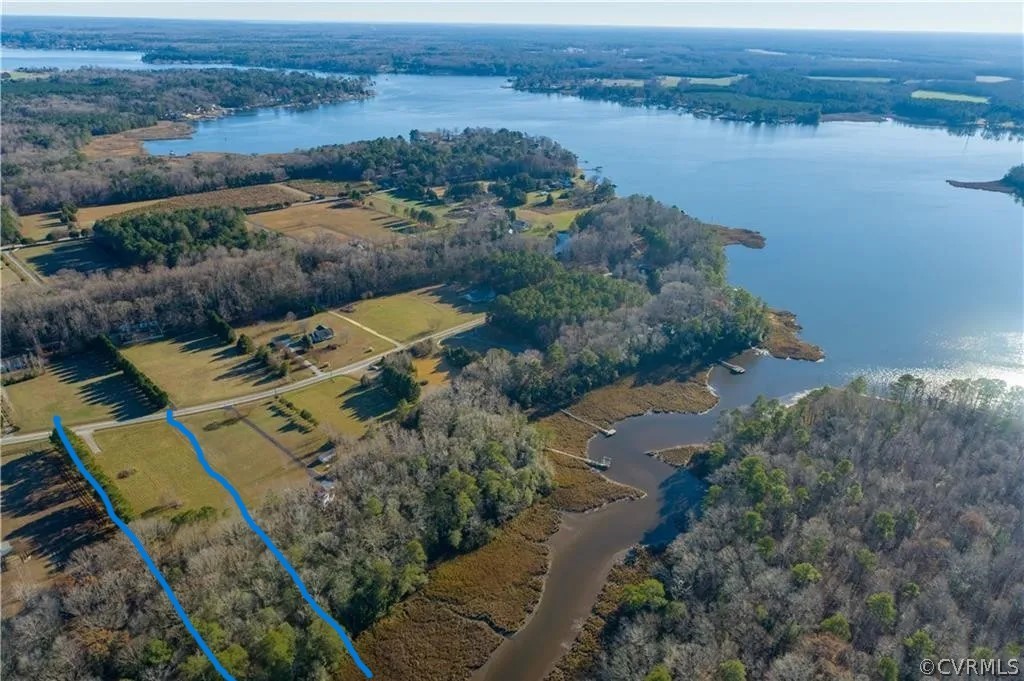 0 Pipe-N-Tree Drive Hartfield, VA 23071 - Photo 2 of 10 an aerial view of a house with a lake view