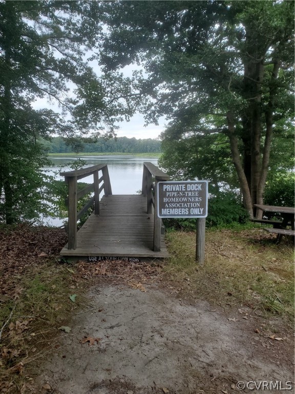 0 Pipe-N-Tree Drive Hartfield, VA 23071 - Photo 3 of 10 a view of a bench in a garden