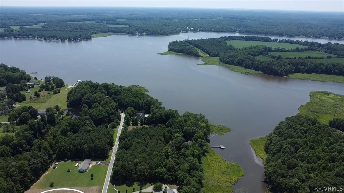 0 Pipe-N-Tree Drive Hartfield, VA 23071 - Photo 5 of 10 an aerial view of a house with a yard and lake view