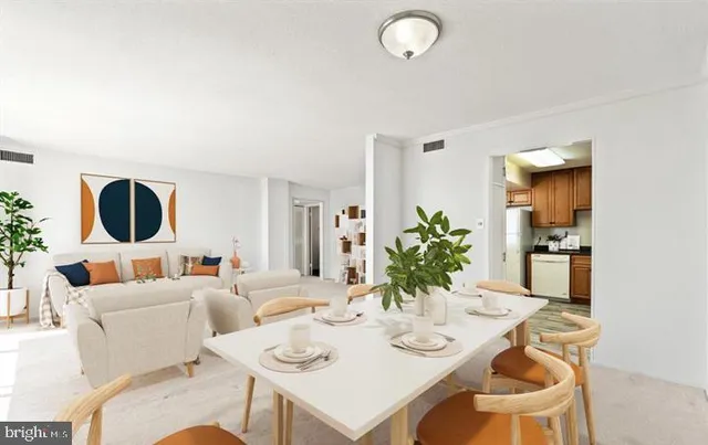 a living room with furniture and a large mirror