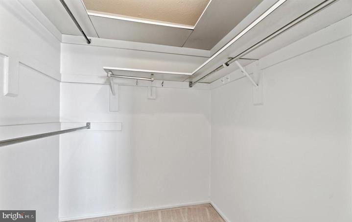118 Monroe Street, Unit 1181109 Rockville, MD 20850 - Photo 27 of 41 a view of a room with racks on the wall