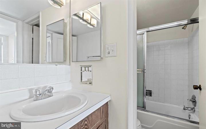 118 Monroe Street, Unit 1181109 Rockville, MD 20850 - Photo 29 of 41 a bathroom with a sink toilet and shower