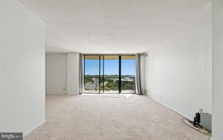 118 Monroe Street, Unit 1181109 Rockville, MD 20850 - Photo 3 of 41 a view of an empty room with a window
