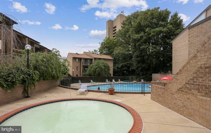 118 Monroe Street, Unit 1181109 Rockville, MD 20850 - Photo 38 of 41 a view of swimming pool with outdoor seating