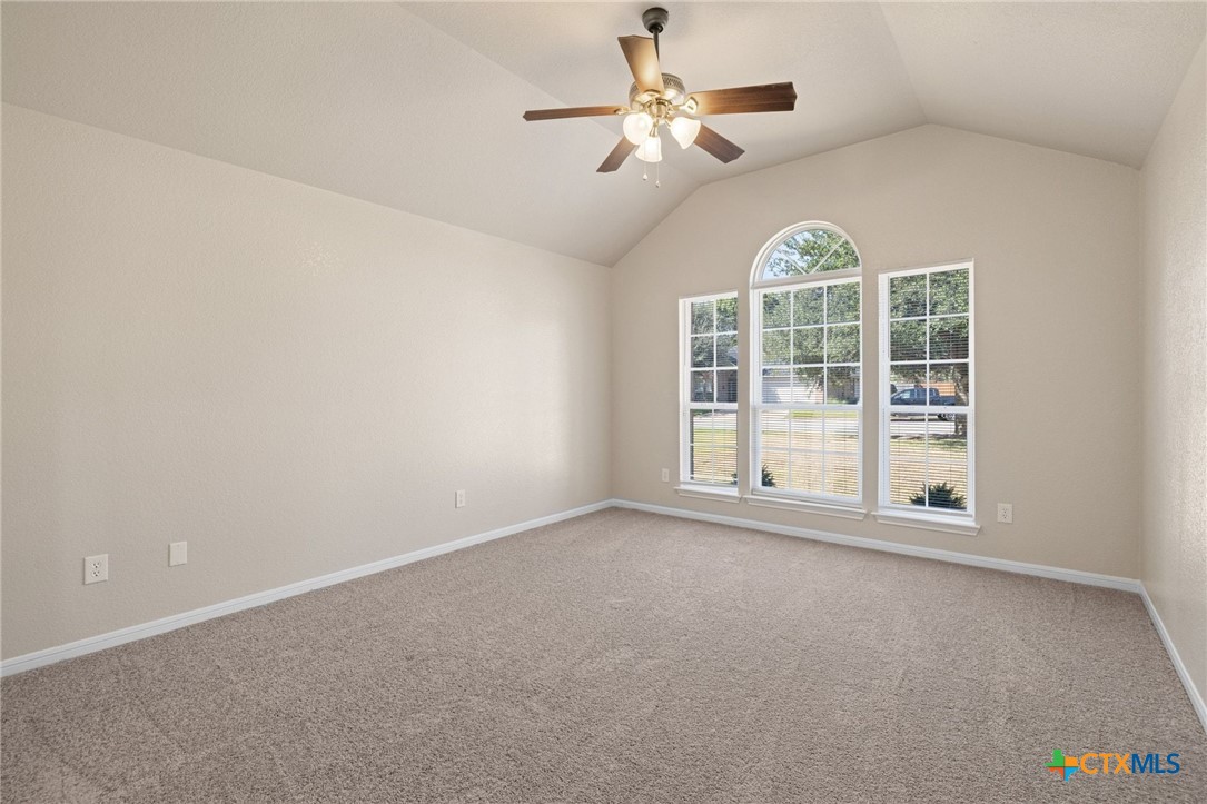 5607 Aberdeen Court Temple, TX 76502 - Photo 14 of 30 an empty room with windows and fan