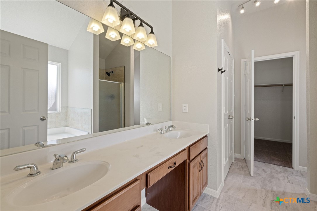 5607 Aberdeen Court Temple, TX 76502 - Photo 15 of 30 a bathroom with a sink vanity and a mirror