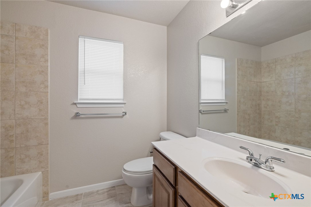 5607 Aberdeen Court Temple, TX 76502 - Photo 20 of 30 a bathroom with a sink toilet and vanity