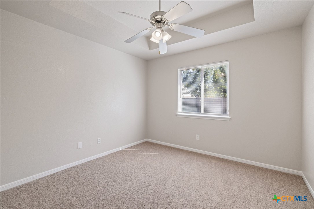 5607 Aberdeen Court Temple, TX 76502 - Photo 21 of 30 an empty room with a window and a fan