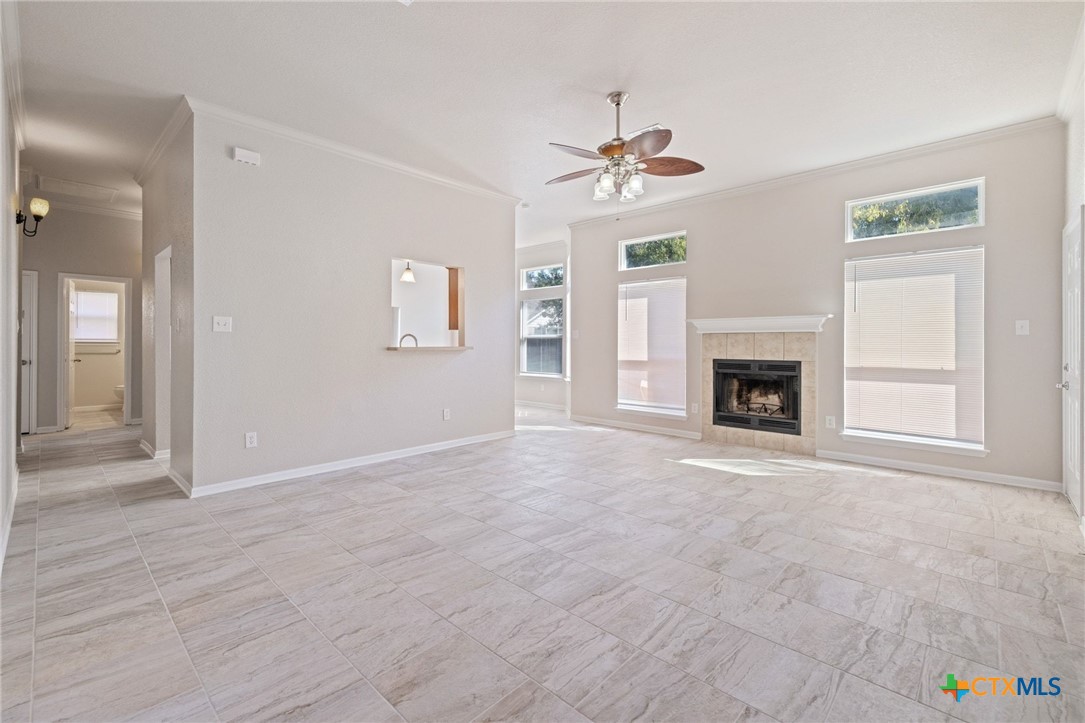 5607 Aberdeen Court Temple, TX 76502 - Photo 7 of 30 an empty room with windows and fireplace