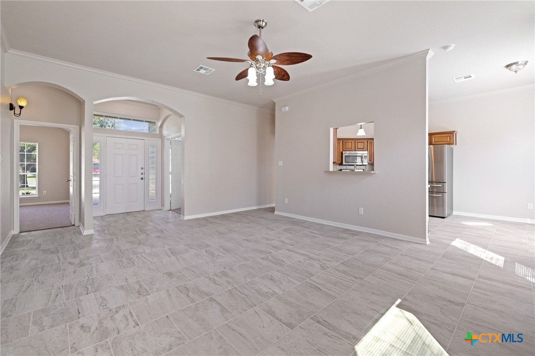 5607 Aberdeen Court Temple, TX 76502 - Photo 8 of 30 wooden floor in an empty room with a window