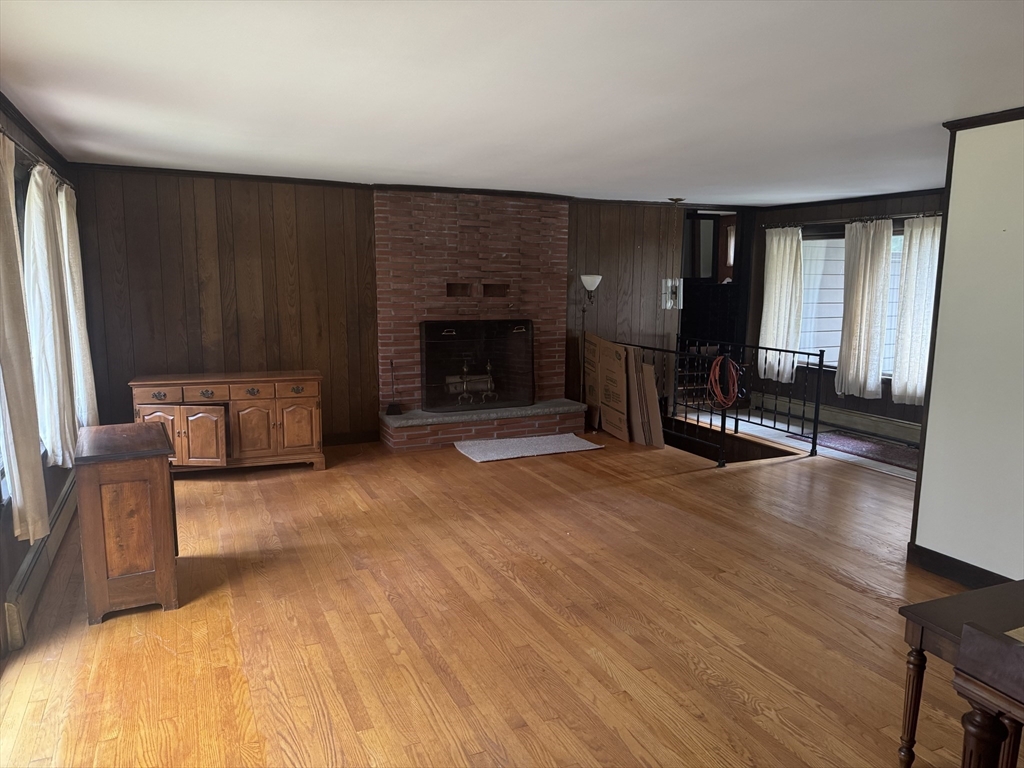 628 Stow Road Boxborough, MA 01719 - Photo 3 of 5 a living room with furniture and a fireplace