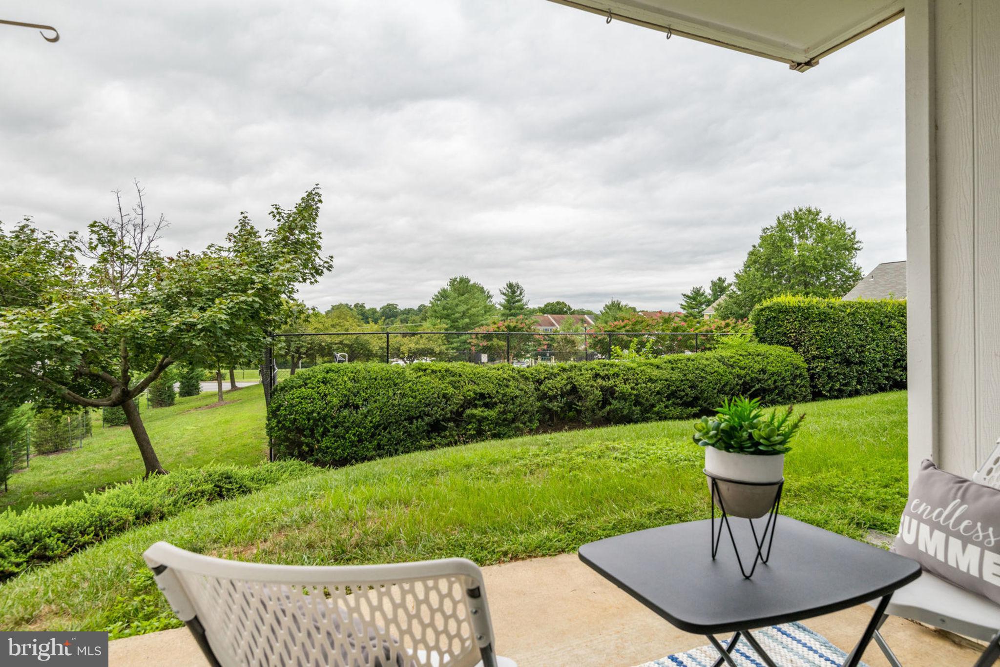 104 Fort Evans Road Southeast, Unit A Leesburg, VA 20175 - Photo 22 of 24 a view of a garden with a patio