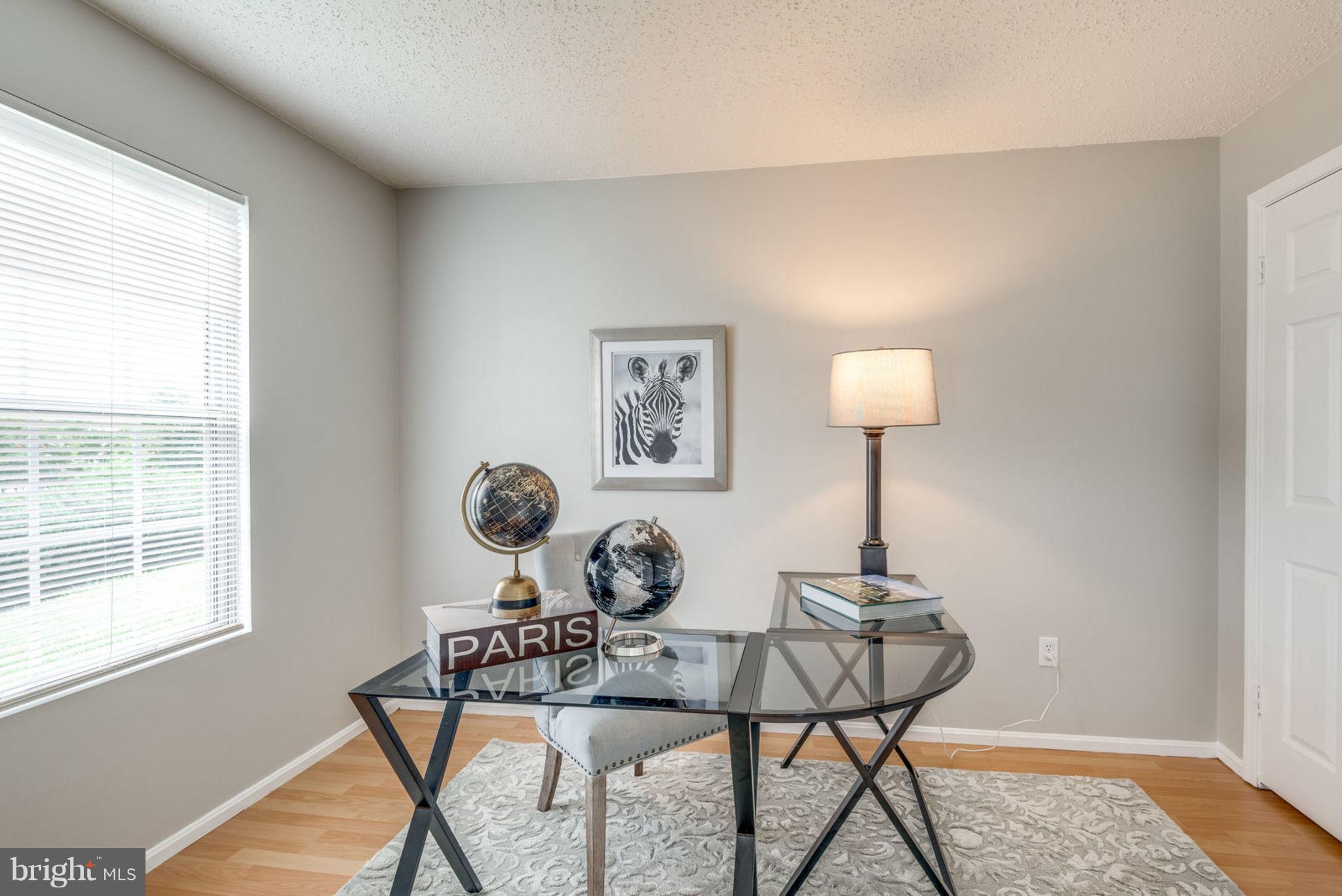 104 Fort Evans Road Southeast, Unit A Leesburg, VA 20175 - Photo 9 of 24 a view of a livingroom with furniture and a window