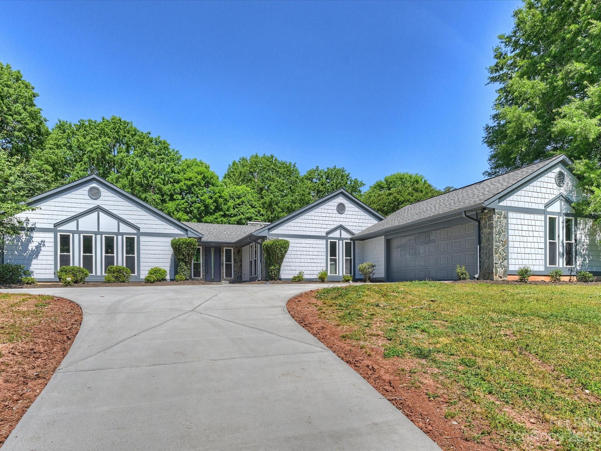4600 Rounding Run Road Charlotte, NC 28277 - Photo 1 of 33 a front view of a house with a yard