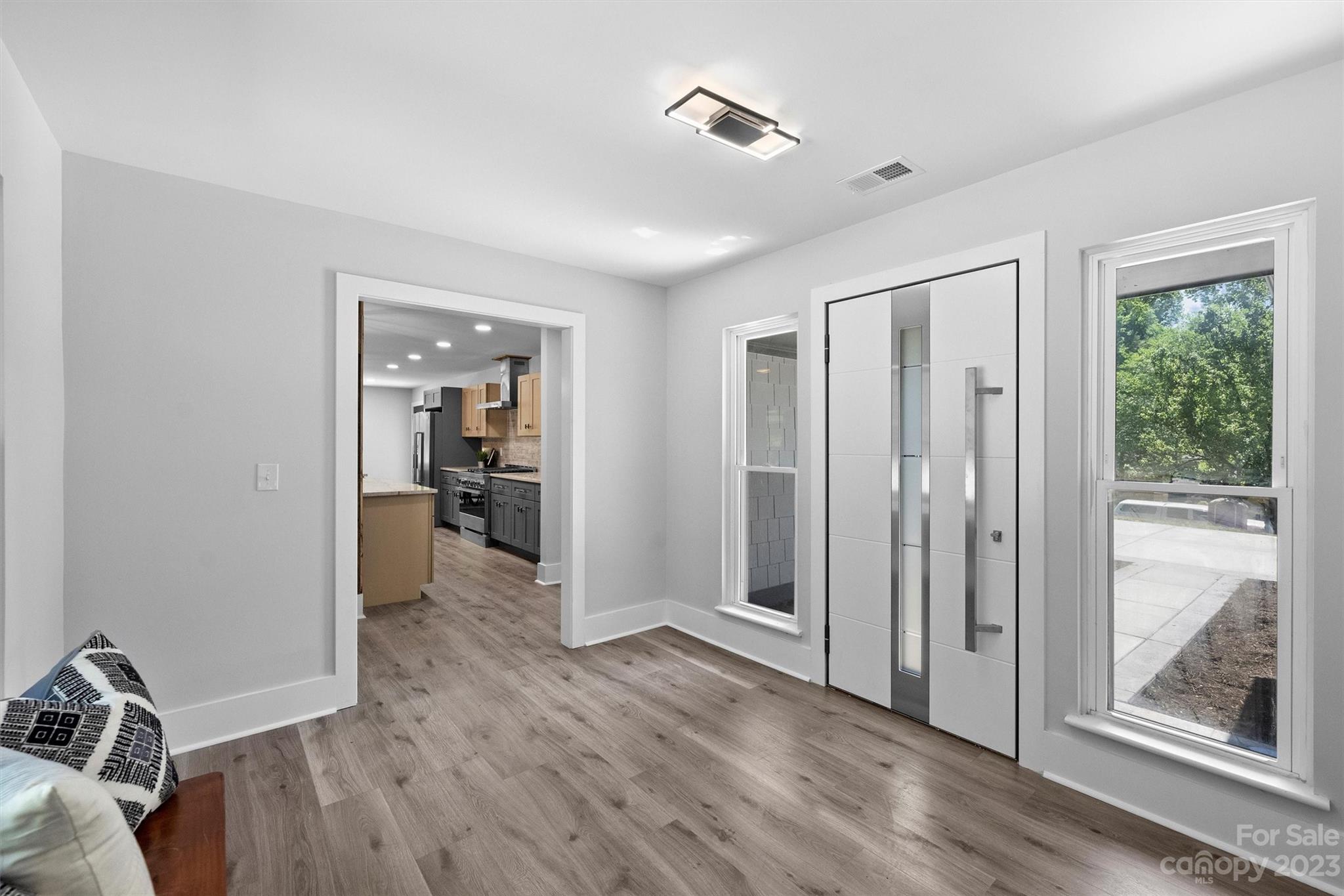 4600 Rounding Run Road Charlotte, NC 28277 - Photo 13 of 33 a view of a livingroom with wooden floor and a bathroom
