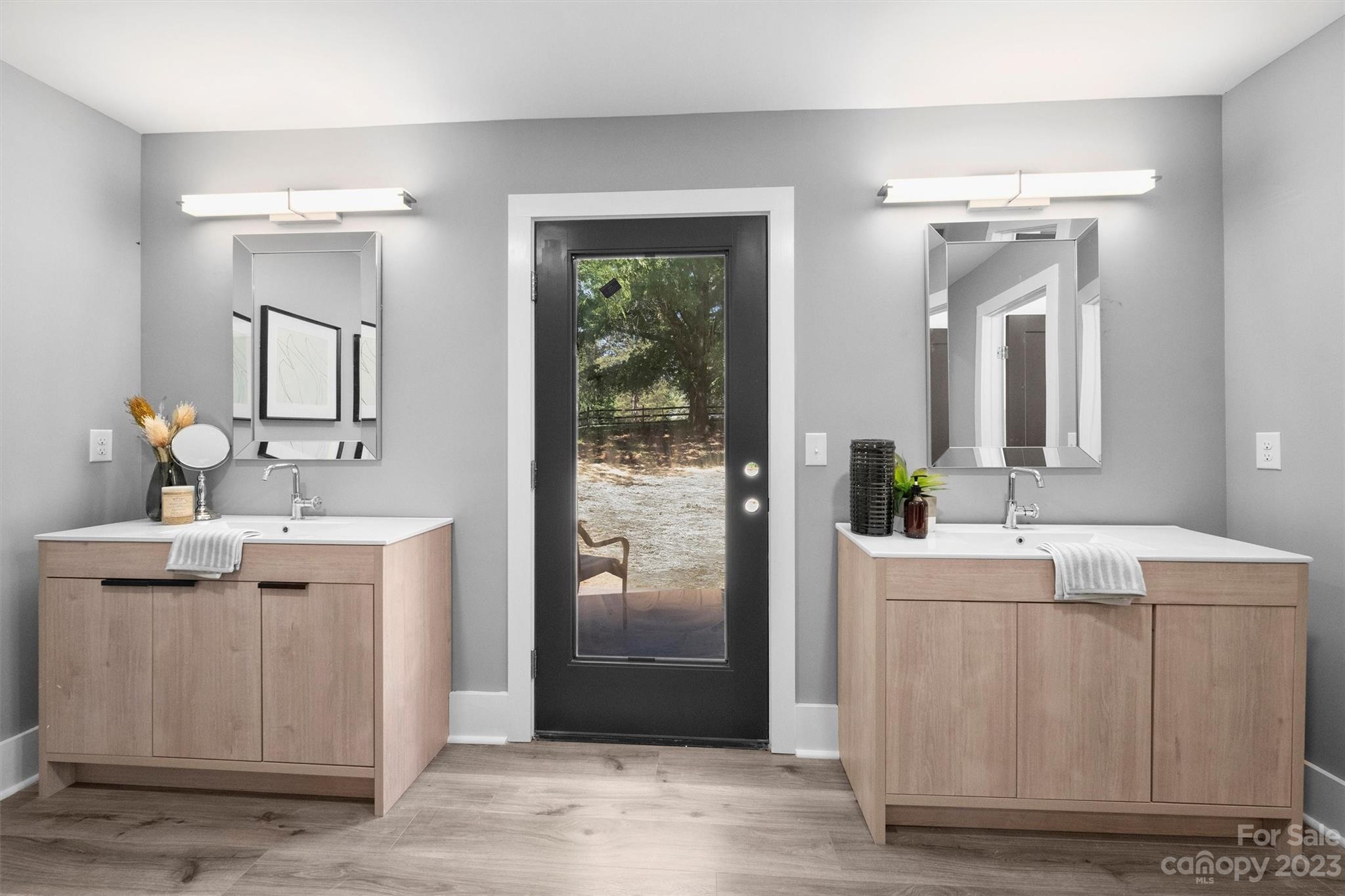 4600 Rounding Run Road Charlotte, NC 28277 - Photo 18 of 33 a bathroom with a double vanity sink mirror and shower