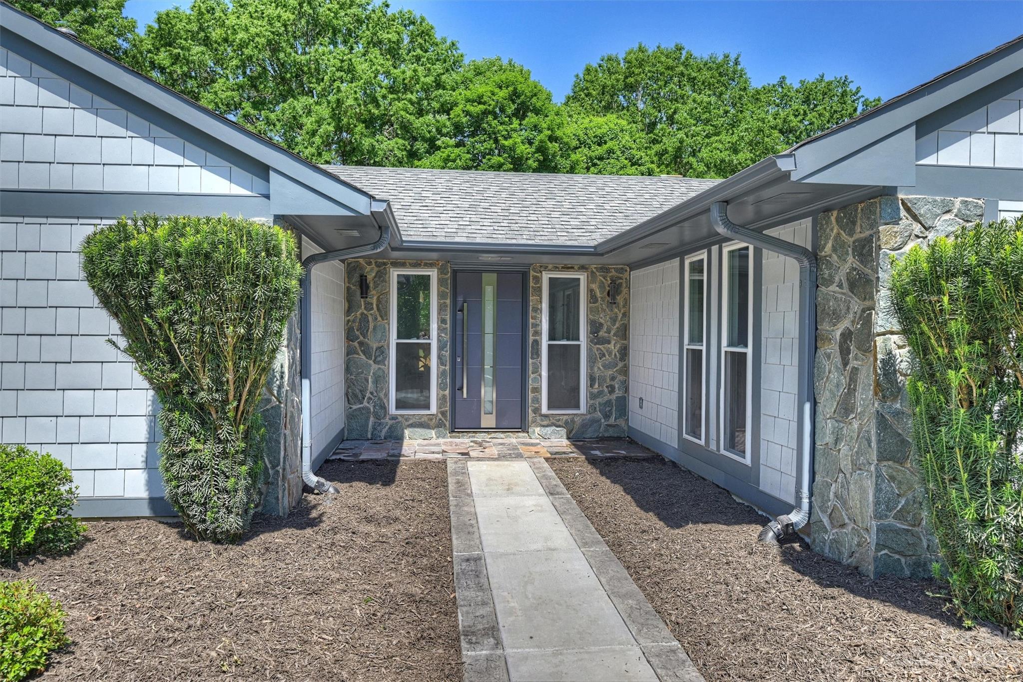 4600 Rounding Run Road Charlotte, NC 28277 - Photo 2 of 33 a front view of a house with garden