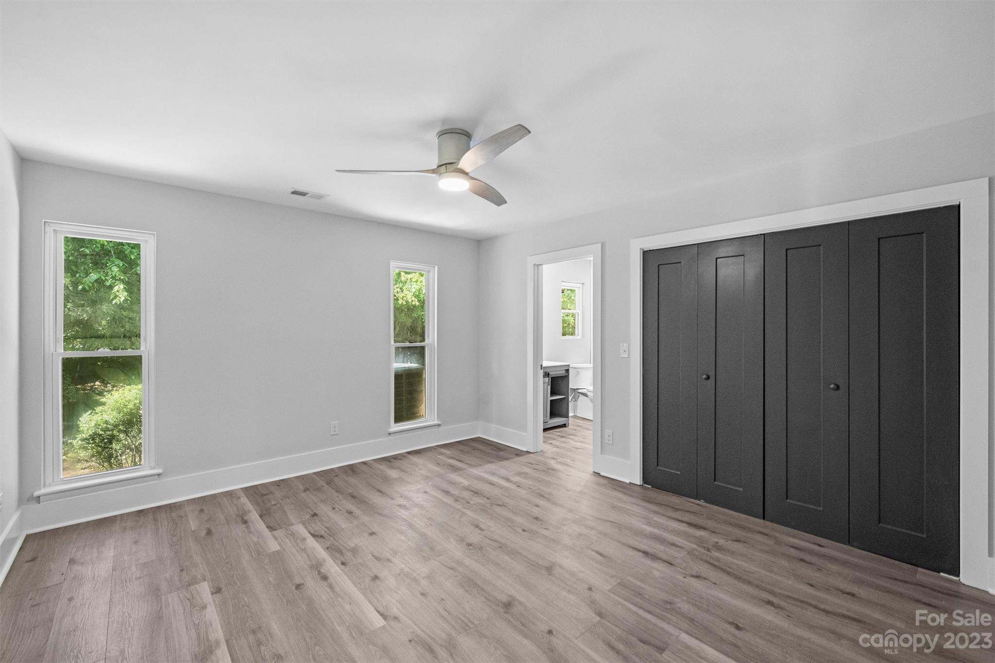 4600 Rounding Run Road Charlotte, NC 28277 - Photo 22 of 33 a view of an empty room with window and wooden floor