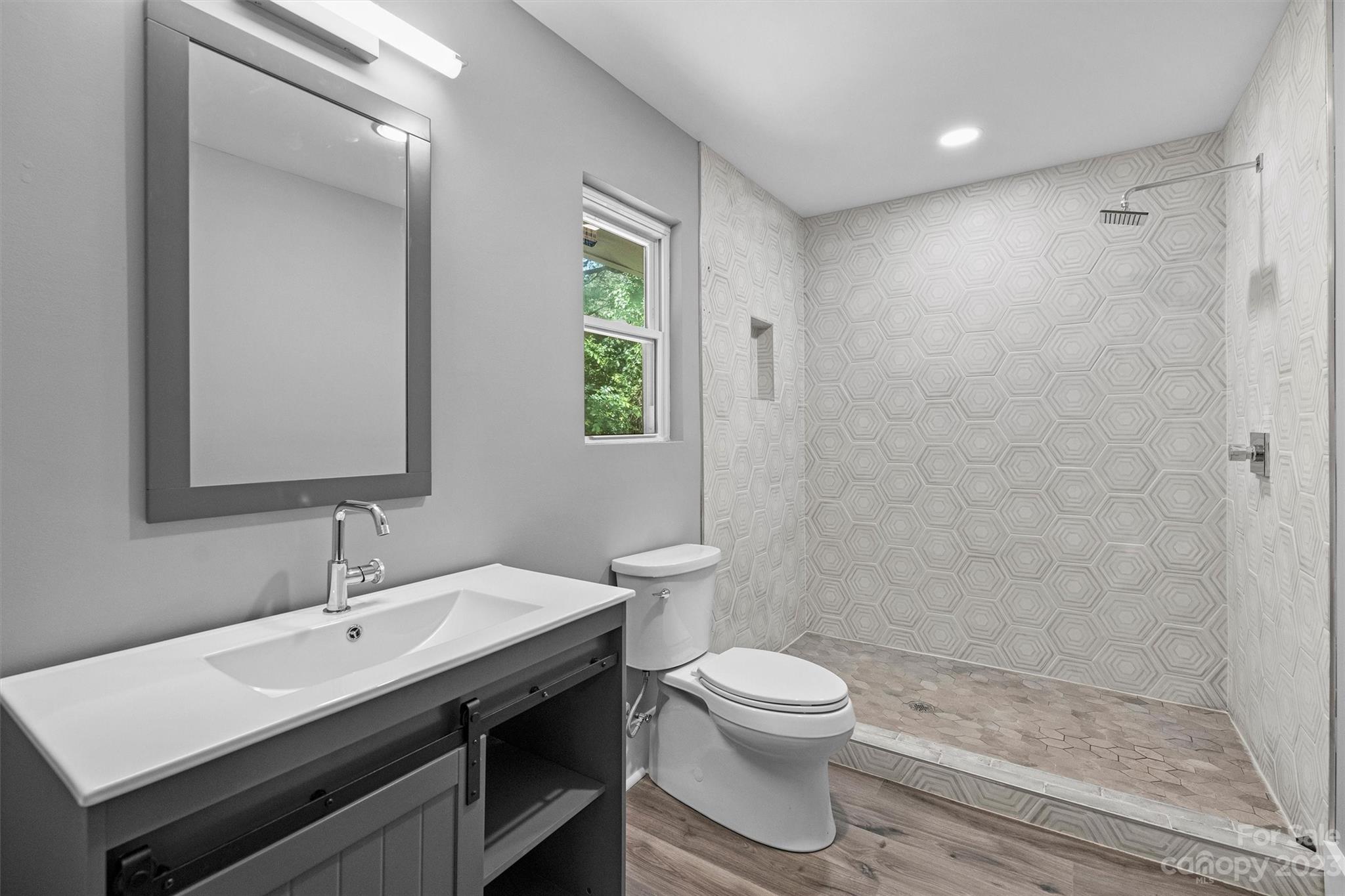 4600 Rounding Run Road Charlotte, NC 28277 - Photo 23 of 33 a bathroom with a sink a toilet and shower